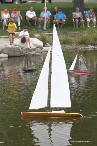 model sailboats on a pond