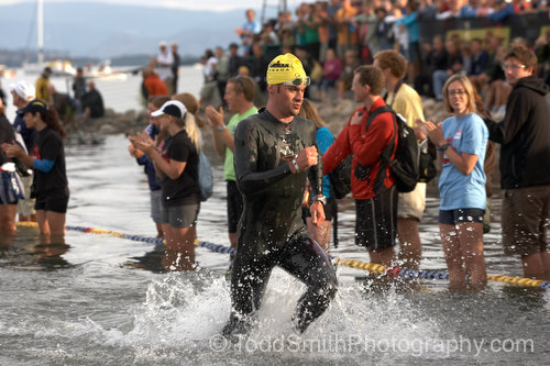The first swimmer runs out of the water at the 2008 Subaru Ironman Canada